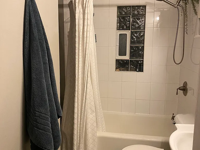 Bathroom has newer shower head.