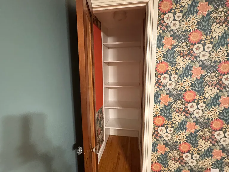 close up of closet at front of front main floor front bedroom