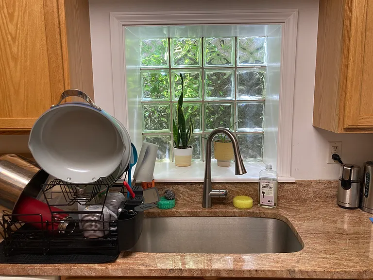 Granite counter. Stainless sink. New faucet.