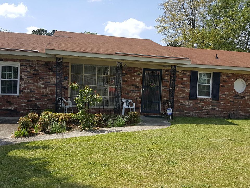 Front of house showing porch and bay window