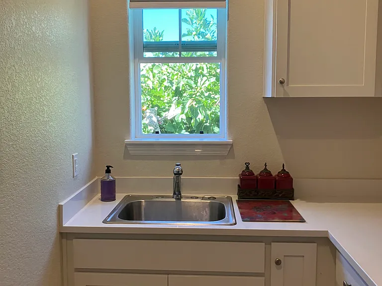 Large laundry room/small appliance room.