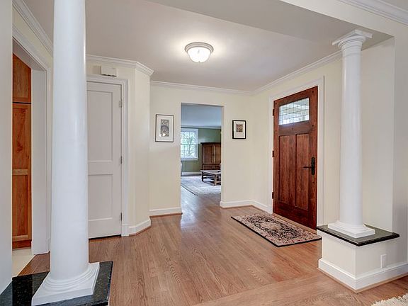 Bright, Open Entryway that leads to Kitchen, Dining Room, and Living Room