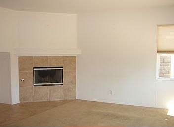 Family room with fireplace and media niche.