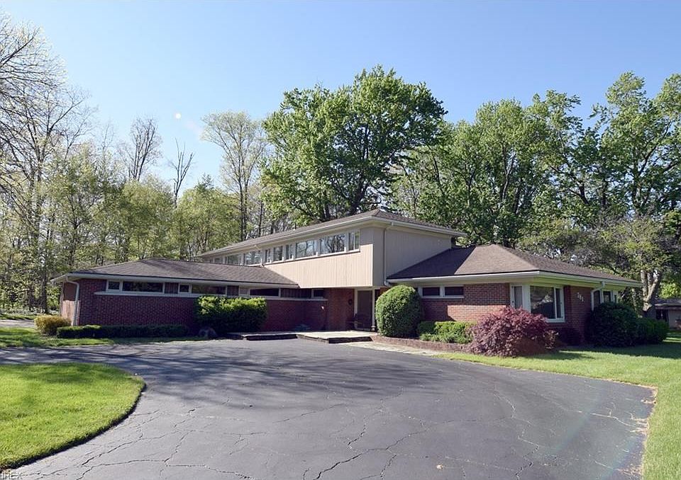Beautiful Falling Waters Inspired Home.  The front entrance has a slate waterfall pond.