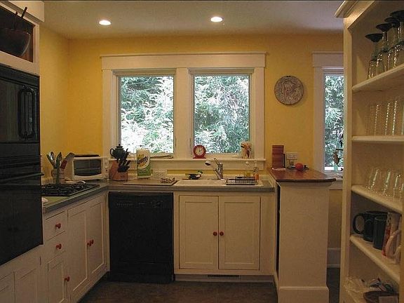 A cook's kitchen with full-sized appliances, gas cooktop and