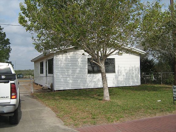 Long concrete drive, mature trees