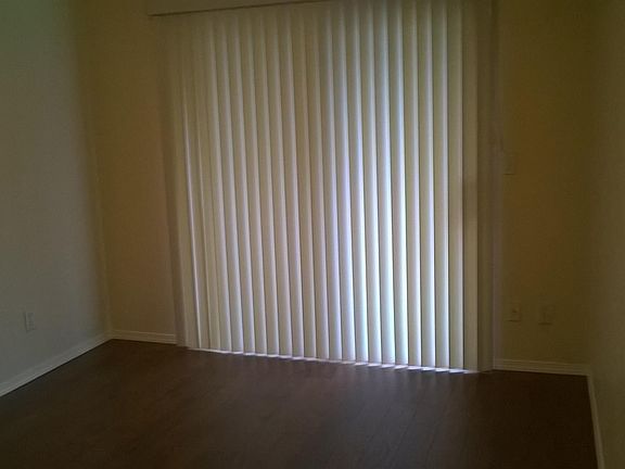 bedroom with access to the back yard patio