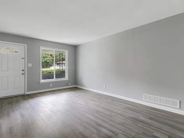 Living room w/ large window into front yard
