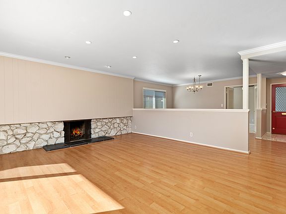 Open floor plan concept with adjacent dining area