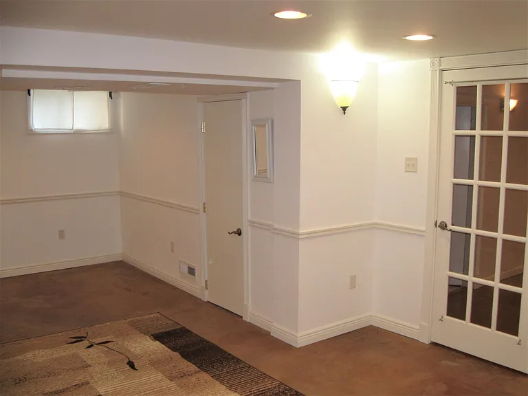 LL bedroom + vintage swing arm curtain rods and 1 of 2 closets