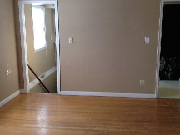 Dining room to lower level (L) and kitchen (R)
