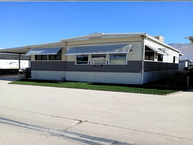 House front and artificial grass
