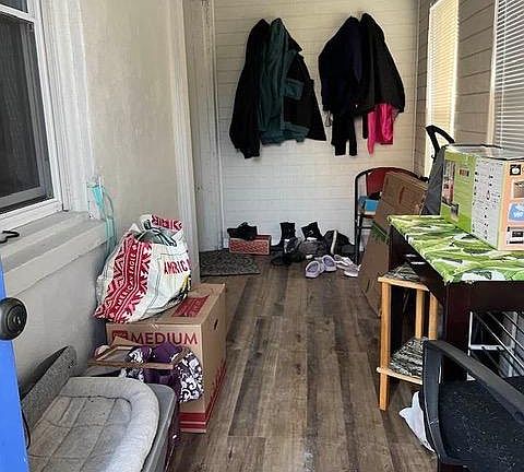 Enclosed front porch, room shoes, boots and jackets