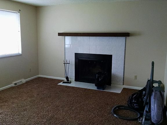 Living room with wood burning fireplace