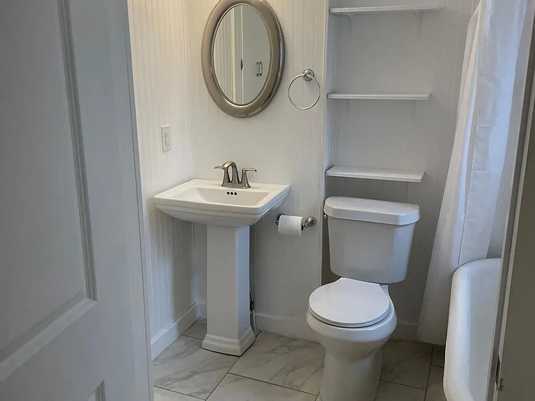 bathroom and clawfoot tub with shower