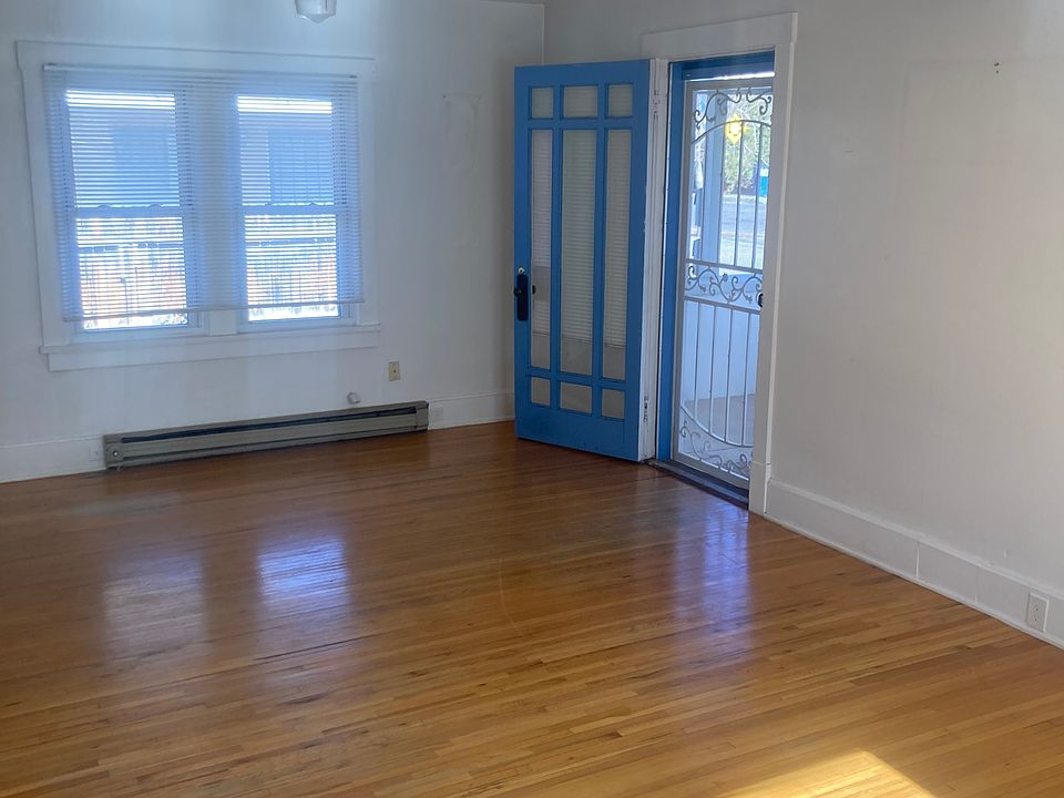 Large 15x30 Living Room with original hardwood floors..