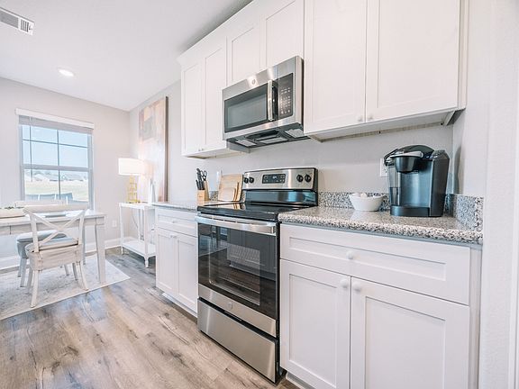 Kitchen in the Opal floorplan at a Meritage Homes community in Gulfport, MS.