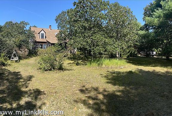 Large front yard with lots of mature plantings!
