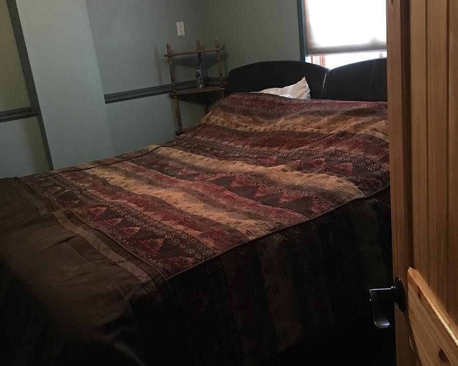 Master bedroom with sliding doors to backyard