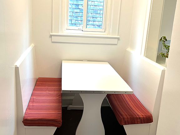 Cute dining nook with kitchen pass-through