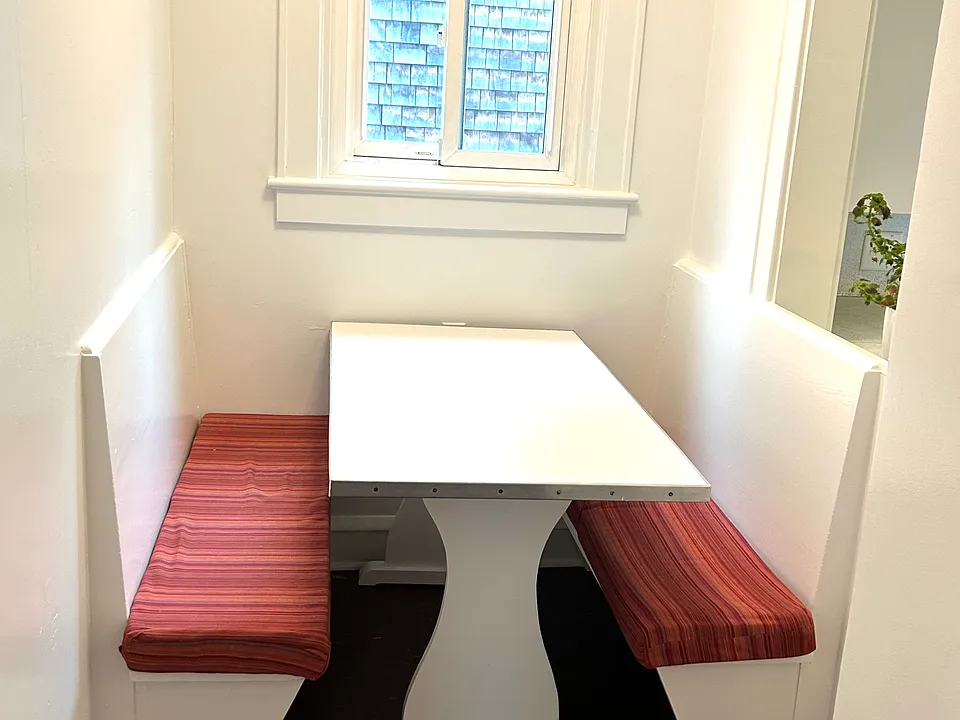 Cute dining nook with kitchen pass-through