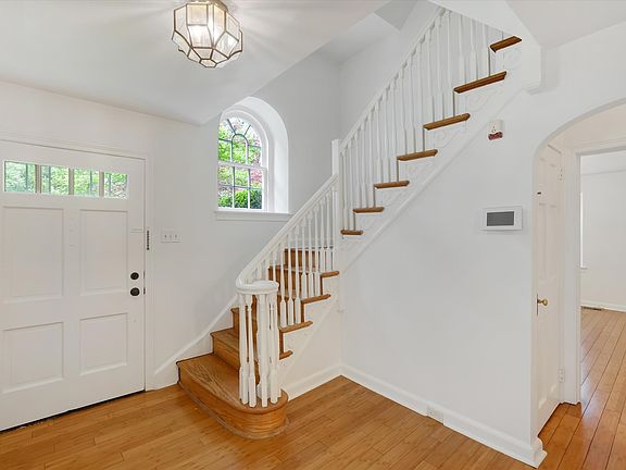 Foyer with hardwood floors and tons of natural light