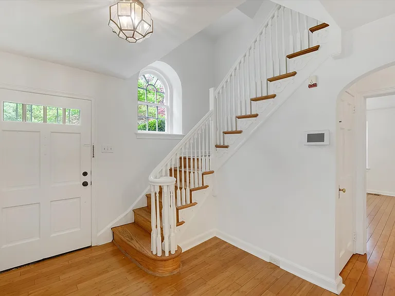 Foyer with hardwood floors and tons of natural light