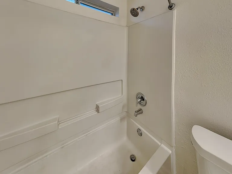 This minimalist bathroom featu