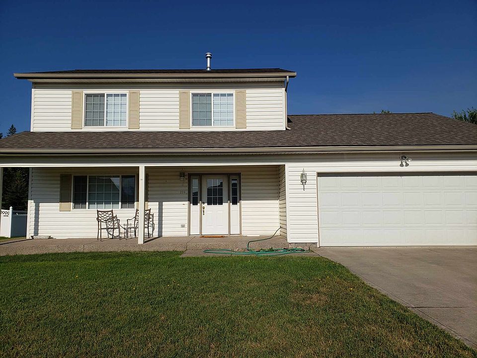 view of house and 2 car garage