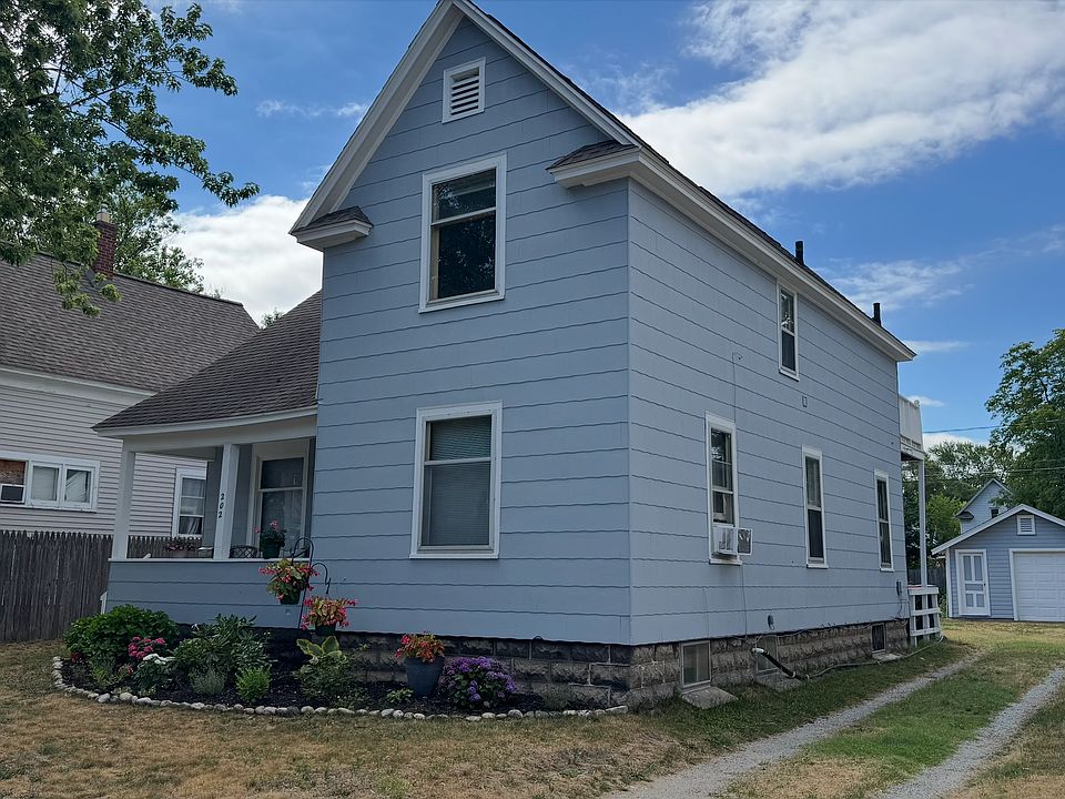 Street view of the home, apartment is in the upper unit.