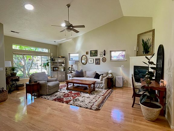 Spacious living room, large windows and a gas fireplace.