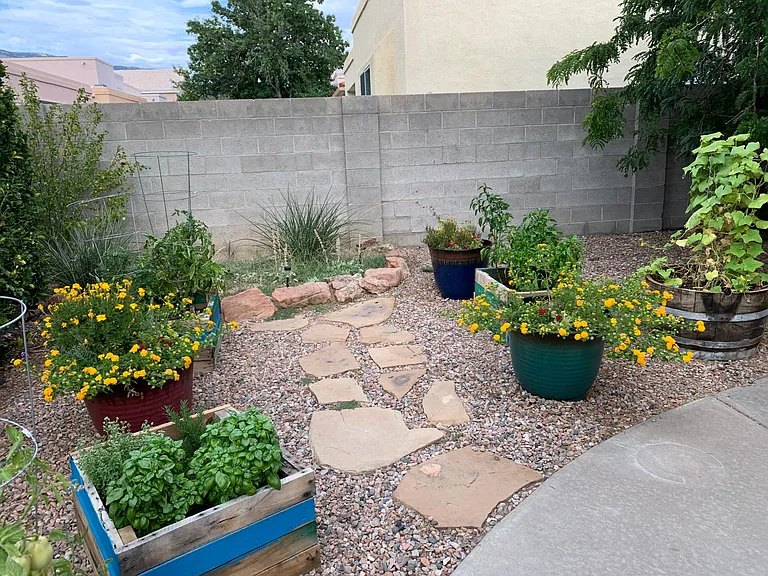 Side patio with space to plant your favorites