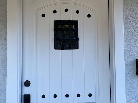 Custom Entry Front Door with iron speak easy and clavos for that old world charm