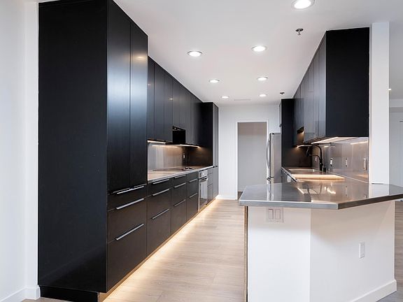 Kitchen with undermount lighting from the dining area.