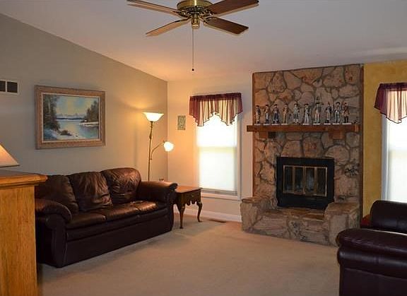 Vaulted ceiling with wood burning rock fireplace and hearth!