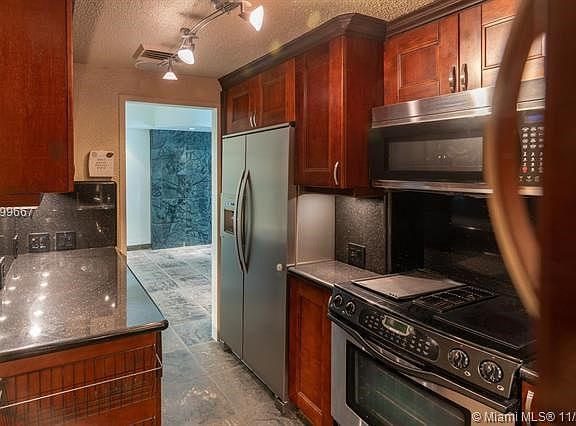 Brazilian Cherry Wood Cabinets and Granite Counters