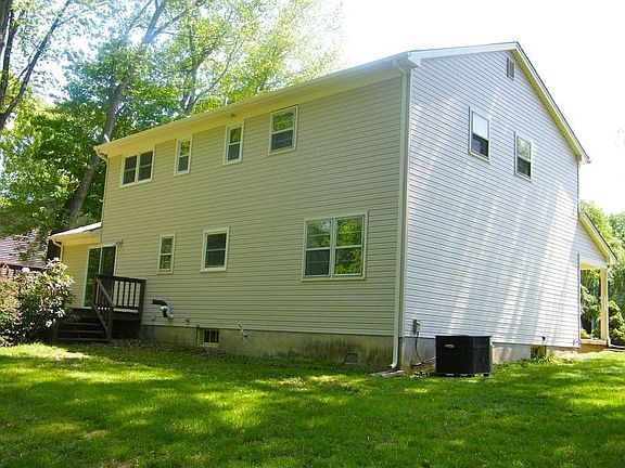 Back of home with new vinyl siding
