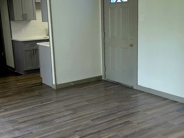 livingroom with LVP flooring and ceiling fan