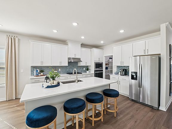 Kitchen in the Sherwood floorplan at a Meritage Homes community in Wendell, NC.
