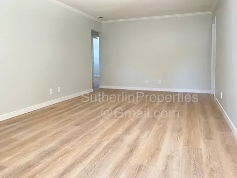West facing view of the very spacious living room area.
