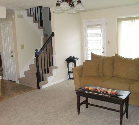 Living room w/ front stairs