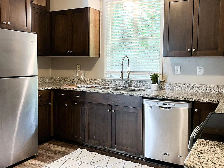 Updated kitchen with stainless appliances and granite countertops