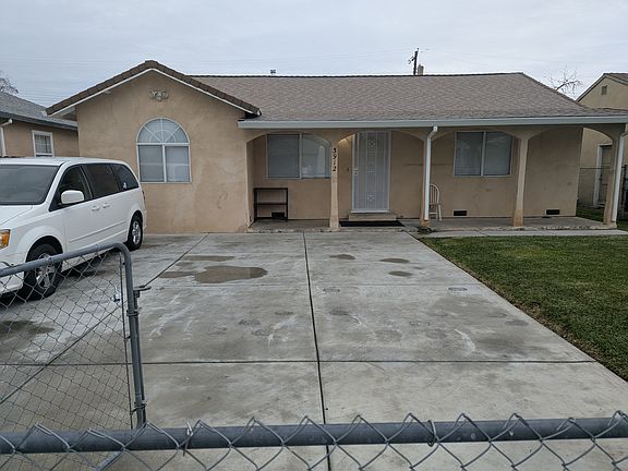 Front driveway lots of room for parking, fenced front yard