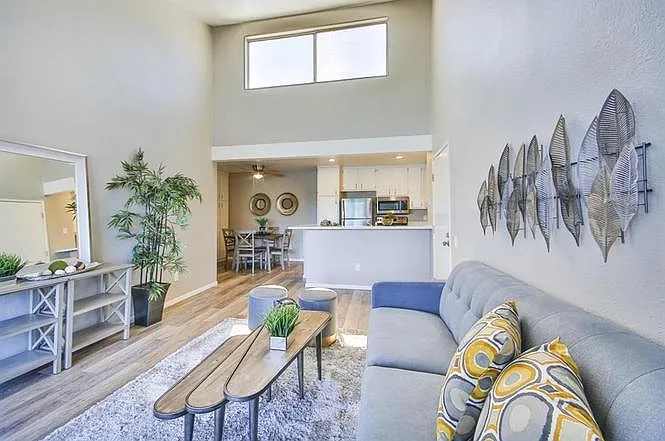 Older photo - lots of light in the unit and vaulted ceilings. The furniture pictured is different.