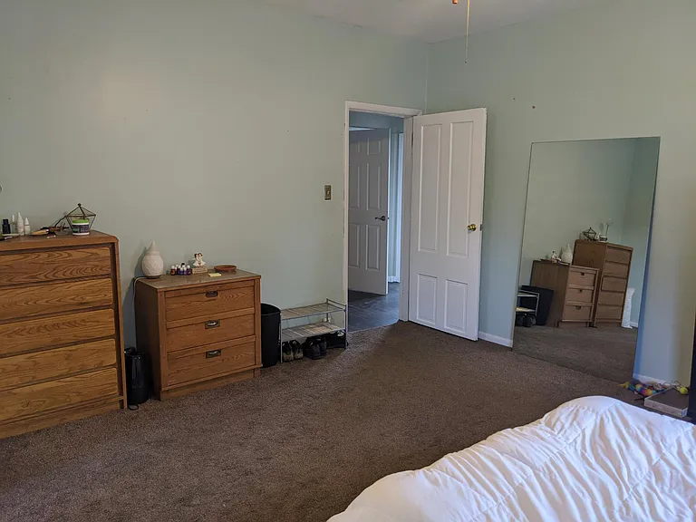 Primary bedroom with door to hallway