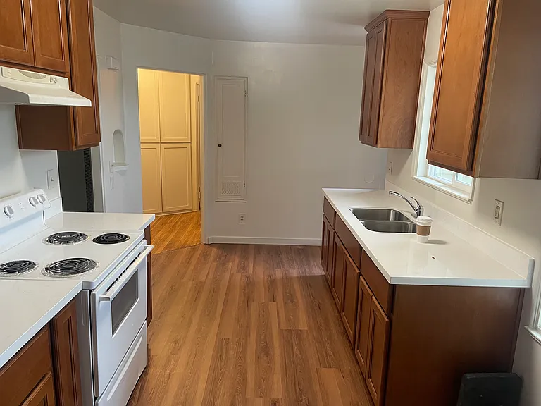 Kitchen looking into hall