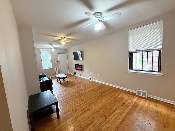 Living Room Includes Mounted TV and Fireplace