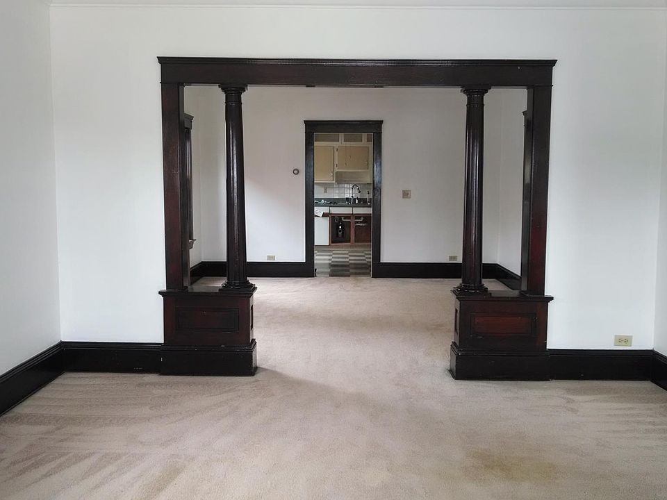 Standing in living and looking into dining area and kitchen.