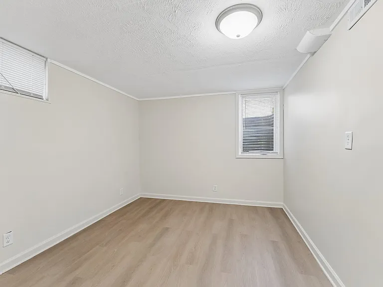 Basement bedroom with egress window