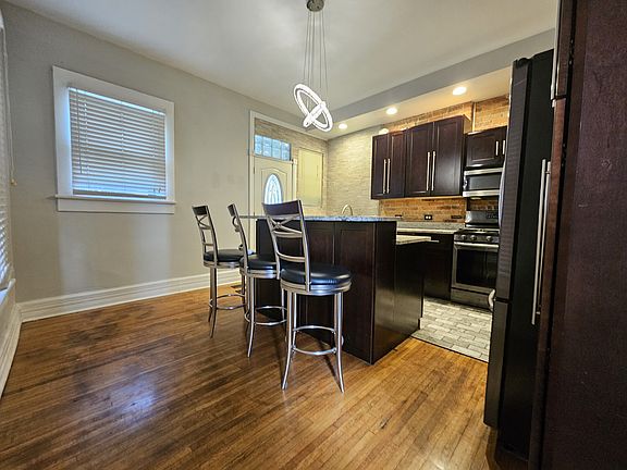 The white door in the picture leads to a personal roomy fenced in backyard.